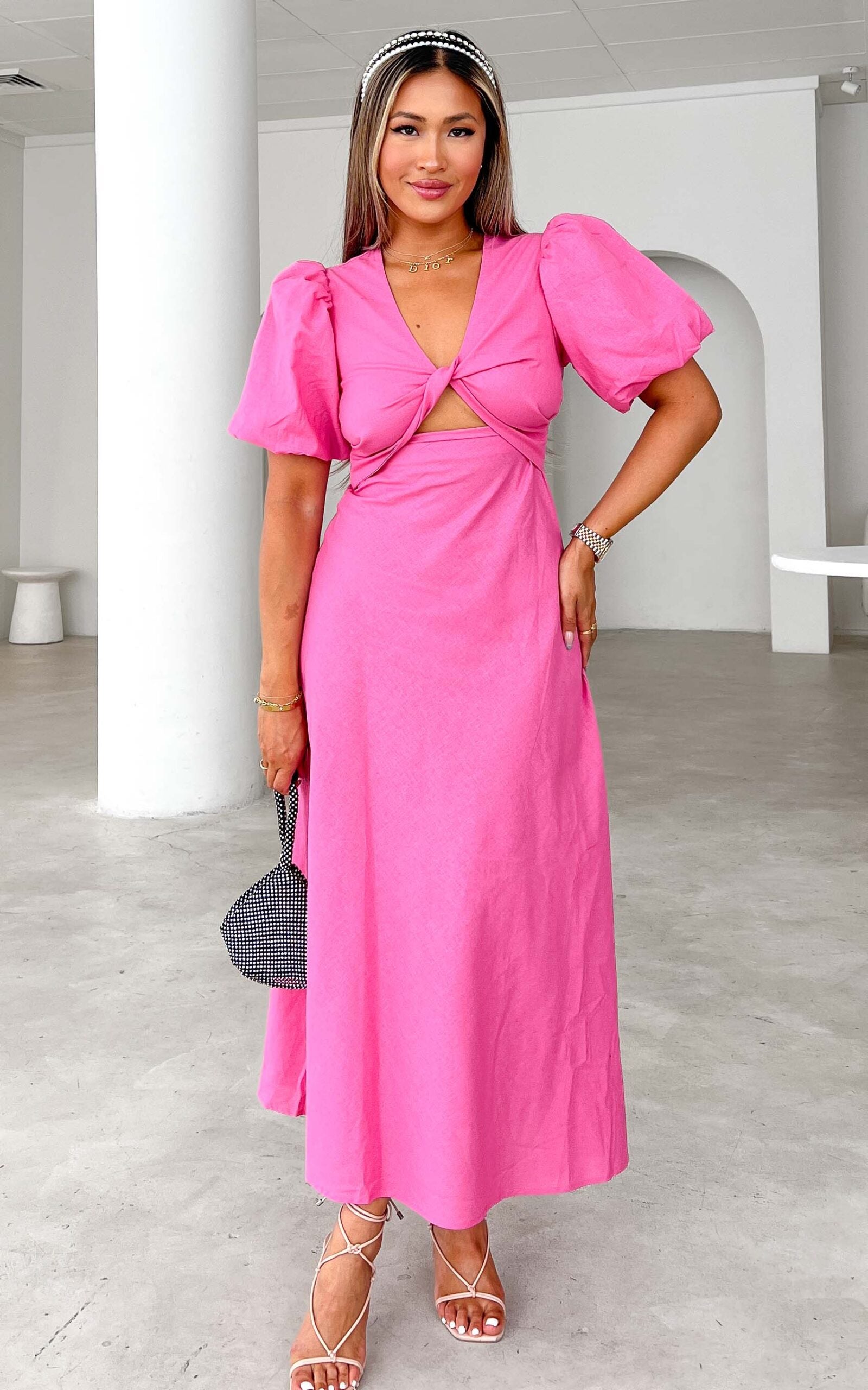 KAMALA V TWIST CUT OUT PUFF SLEEVE MAXI DRESS - BARBIE PINK By Amica KAMALA V TWIST CUT OUT PUFF SLEEVE MAXI DRESS - BARBIE PINK By Amica
