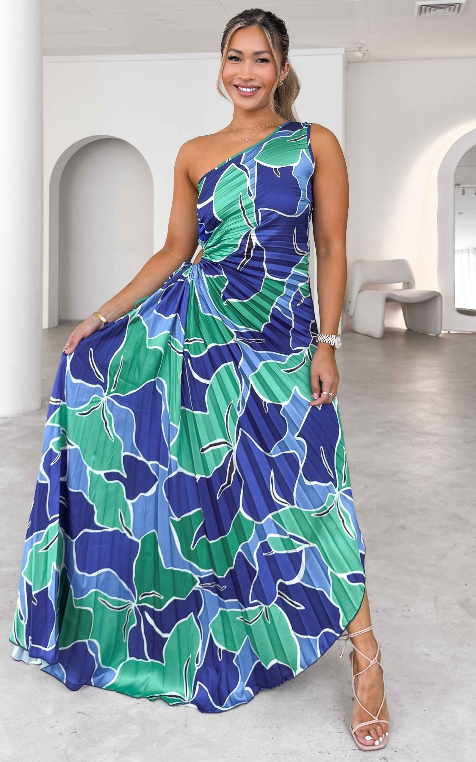 ROCHELLE ONE SHOULDER SLEEVELESS ADJUSTABLE SIDE CUT OUT ASYMMETRIC PLEATED MAXI DRESS - BLUE GREEN FLORAL By Amica ROCHELLE ONE SHOULDER SLEEVELESS ADJUSTABLE SIDE CUT OUT ASYMMETRIC PLEATED MAXI DRESS - BLUE GREEN FLORAL By Amica