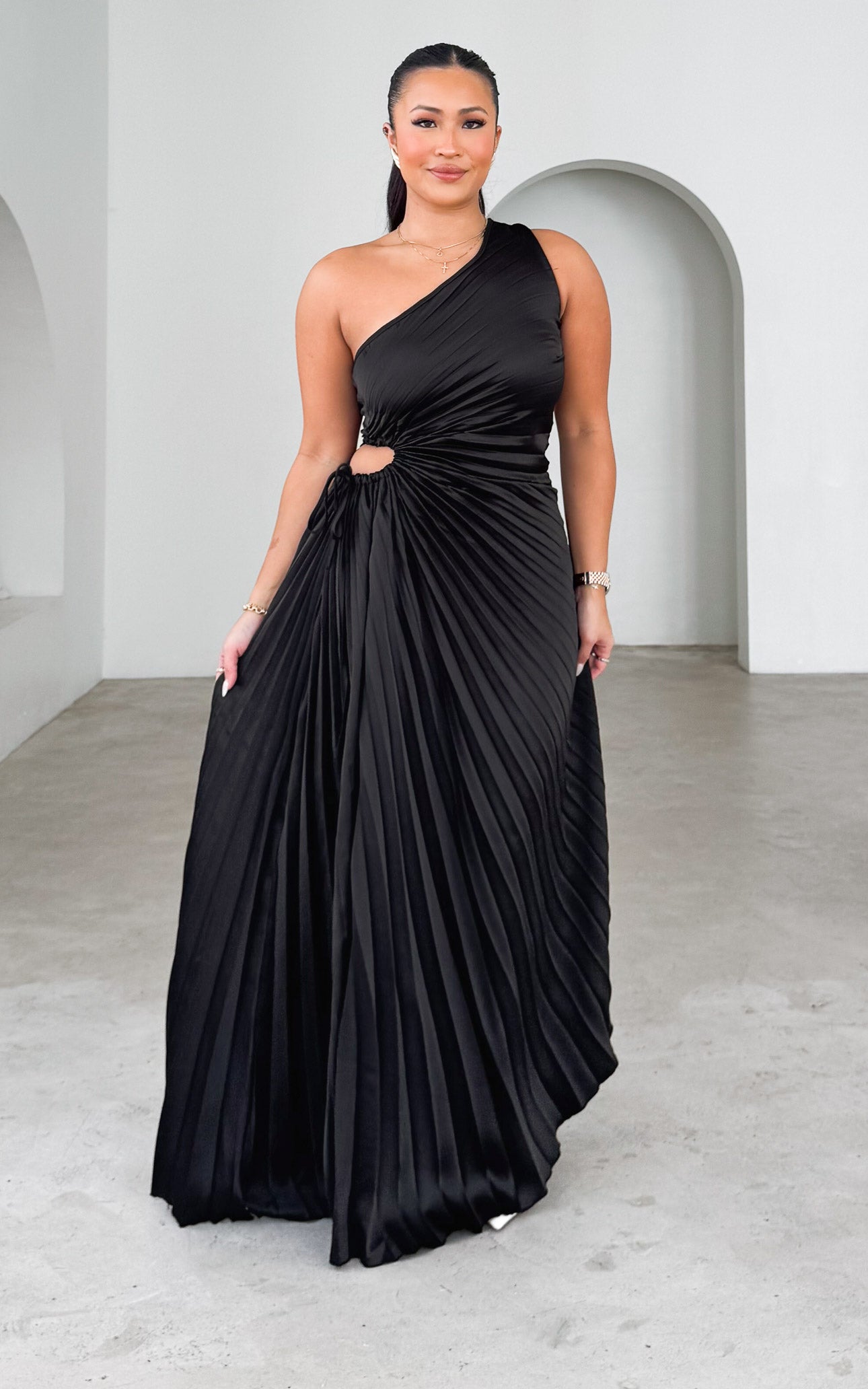 ROCHELLE ONE SHOULDER SLEEVELESS ADJUSTABLE SIDE CUT OUT ASYMMETRIC PLEATED MAXI DRESS - BLACK By Amica ROCHELLE ONE SHOULDER SLEEVELESS ADJUSTABLE SIDE CUT OUT ASYMMETRIC PLEATED MAXI DRESS - BLACK By Amica