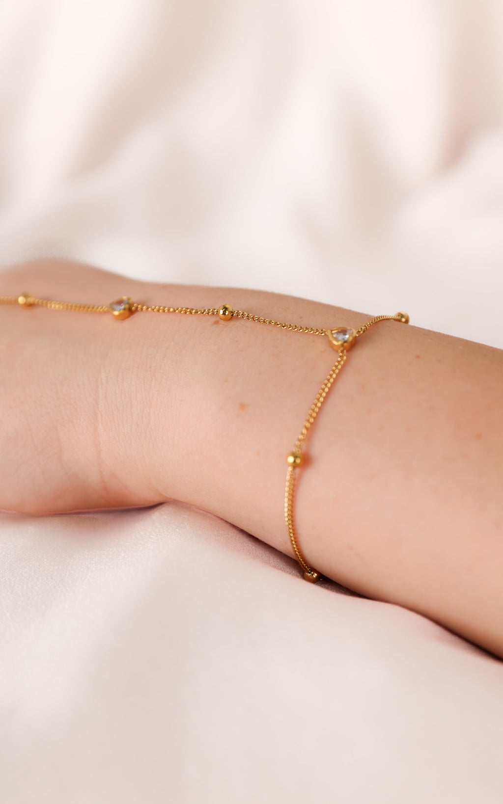 Chichi Hand Chain - Gold Bead Heart Diamante